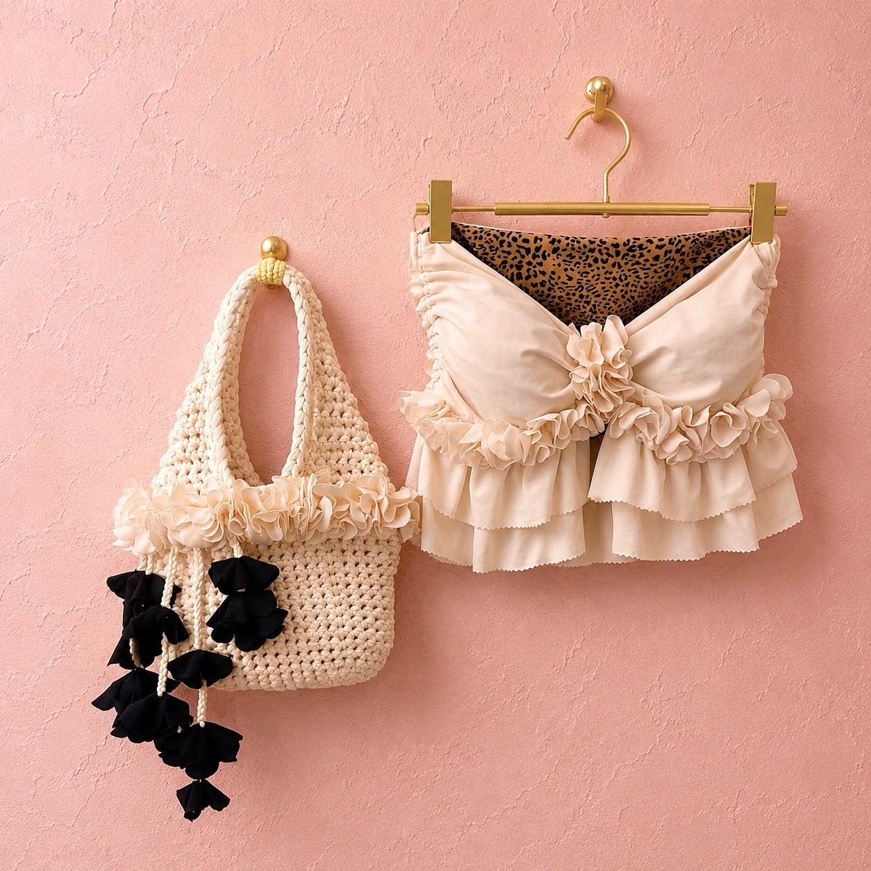 Handmade magnolia cream and onyx black crochet petal bell floral mini bag paired with magnolia cream frilly flower top. 