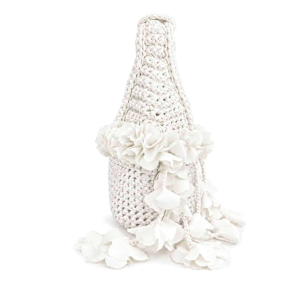 Handmade crochet petal bell mini bag in gardenia white, with braided handle and cascading petal trim. 