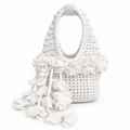 Handmade crochet petal bell mini bag in gardenia white, with braided handle and cascading petal trim. 
