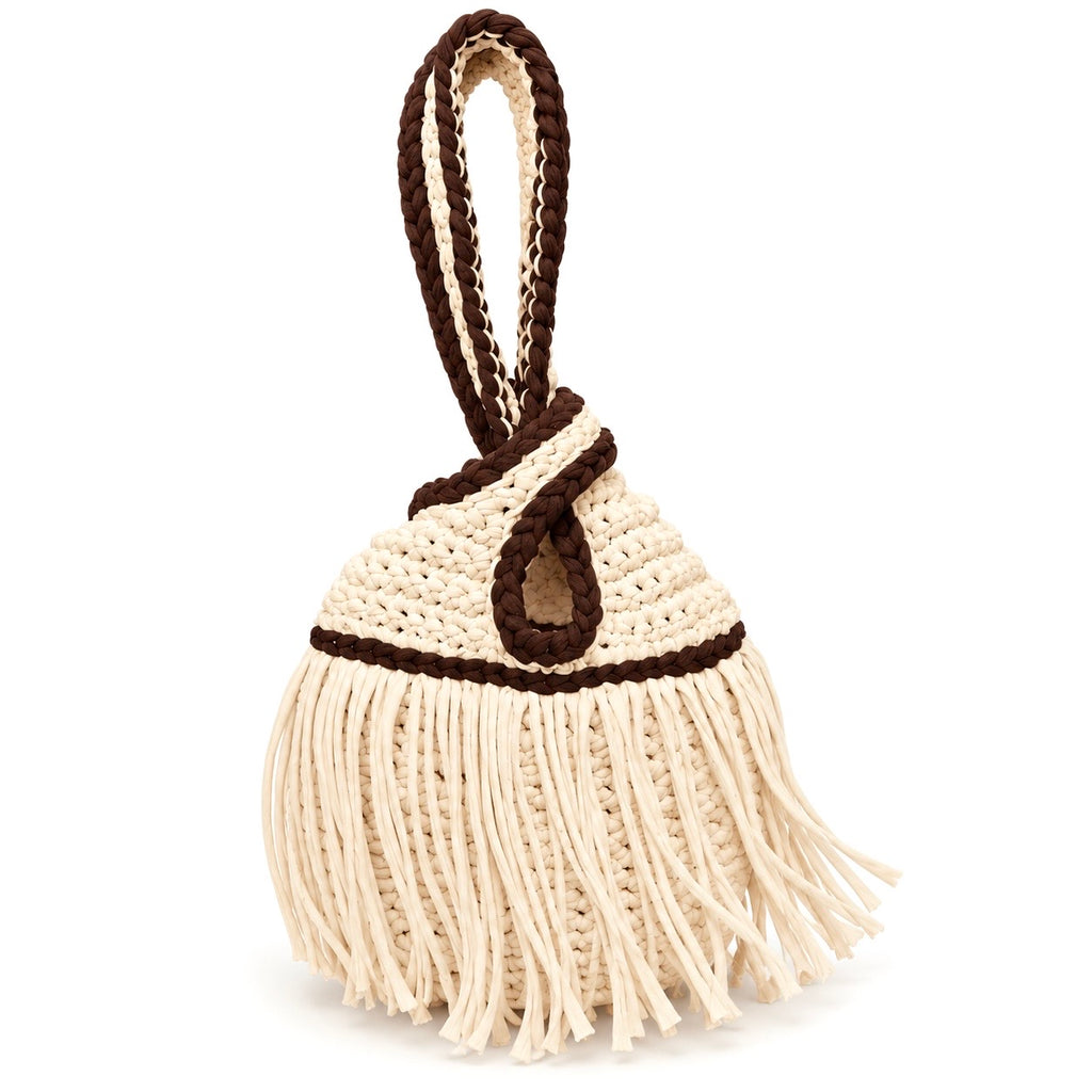 Handmade crochet mini swing bag in Magnolia cream with flowing fringe, Coconut Shell brown trim and a loop-through wristlet handle.