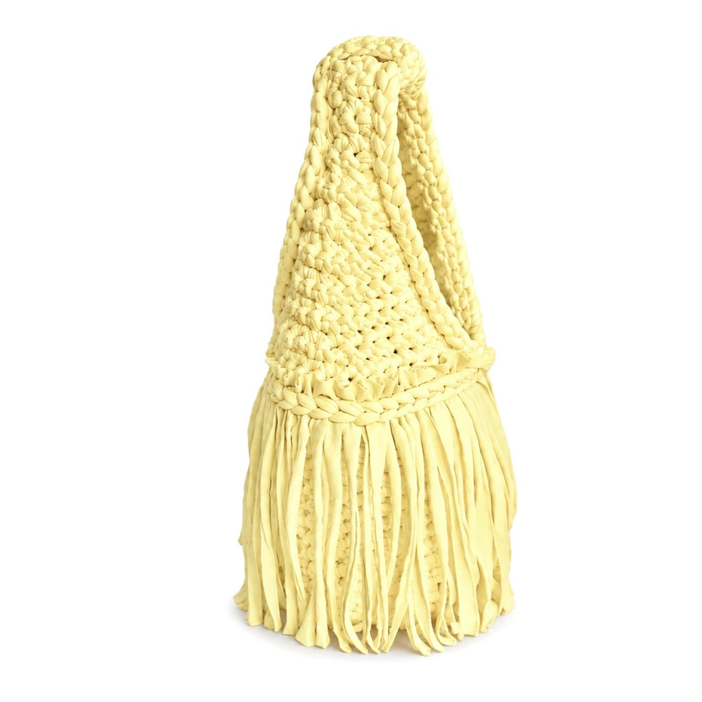 Handmade Daffodil light yellow crochet fringe mini bag with flowing fringe and a braided handle.