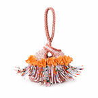 Handmade crochet mini swing bag in Desert Bloom tan with orange flower fringe and a loop-through wristlet handle.