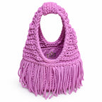 Handmade Orchid pink purple crochet fringe mini bag with flowing fringe and a braided handle.