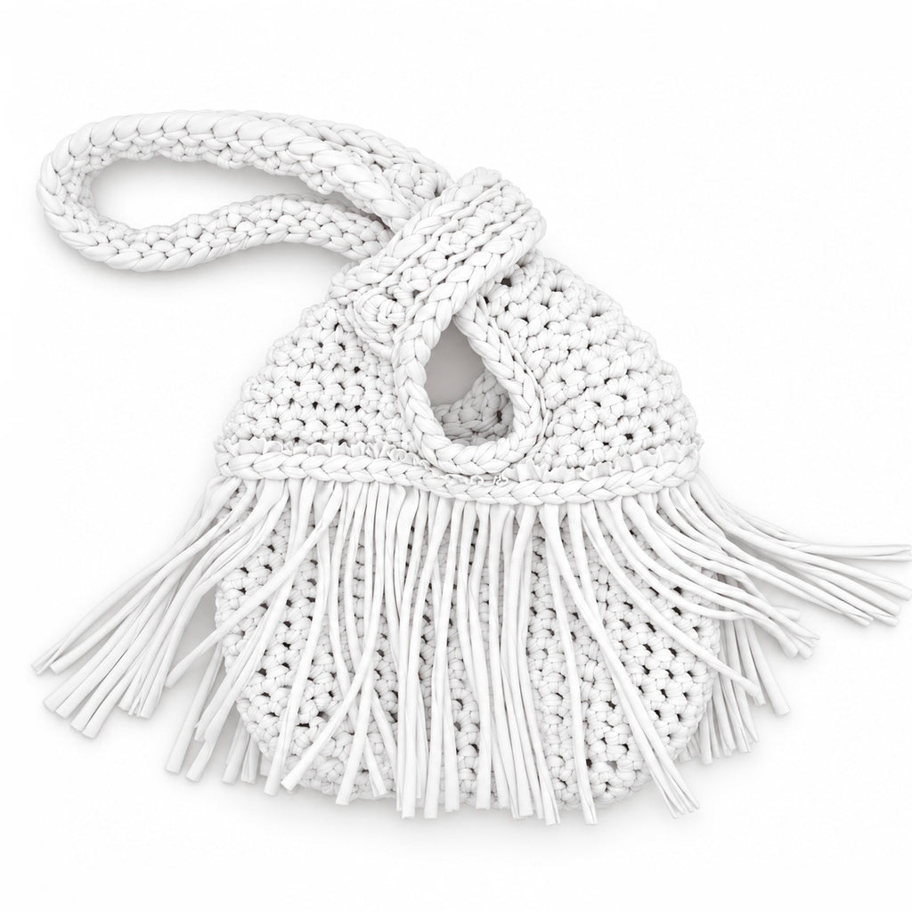 Handmade crochet mini swing bag in Gardenia white with flowing fringe and a loop-through wristlet handle.