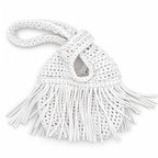 Handmade crochet mini swing bag in Gardenia white with flowing fringe and a loop-through wristlet handle.