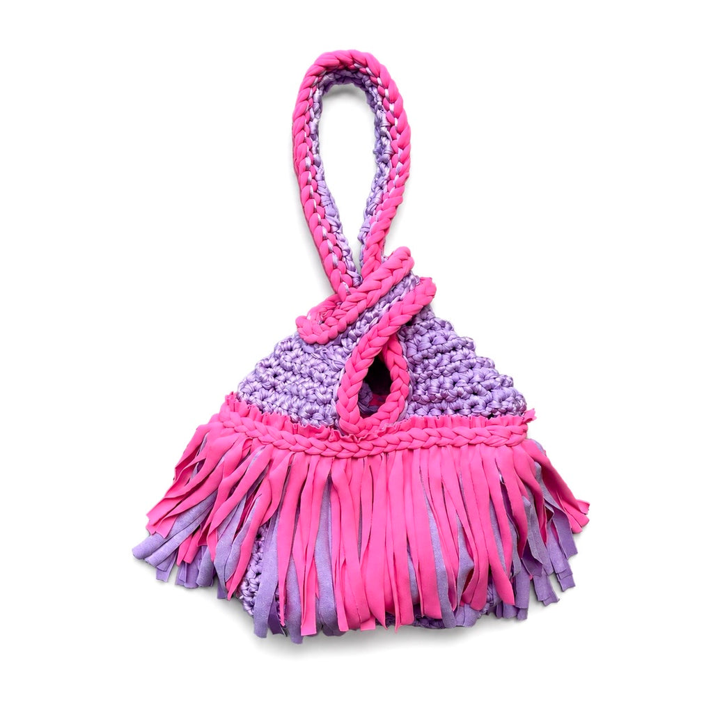 Handmade crochet mini swing bag in Hibiscus pink and Lilac purple with two-tone fringe and a loop-through wristlet handle.