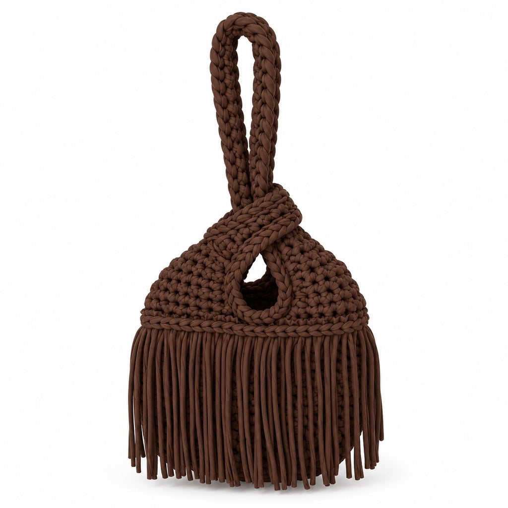 Handmade crochet mini swing bag in Coconut brown with flowing fringe and a loop-through wristlet handle.