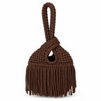 Handmade crochet mini swing bag in Coconut brown with flowing fringe and a loop-through wristlet handle.