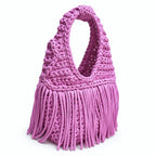 Handmade Orchid pink purple crochet fringe mini bag with flowing fringe and a braided handle.