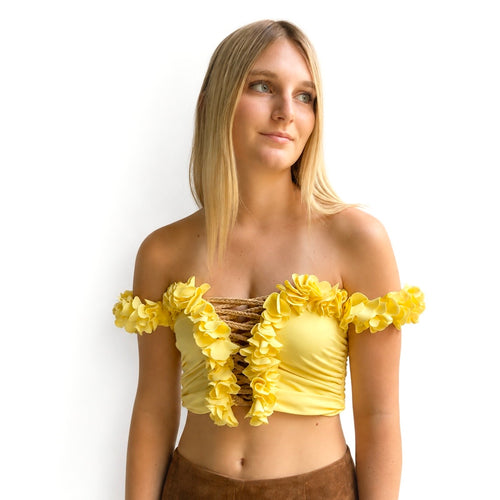 Daffodil yellow floral off-the-shoulder crop top with flower lei trim and hand-crocheted lace-up center detail.
