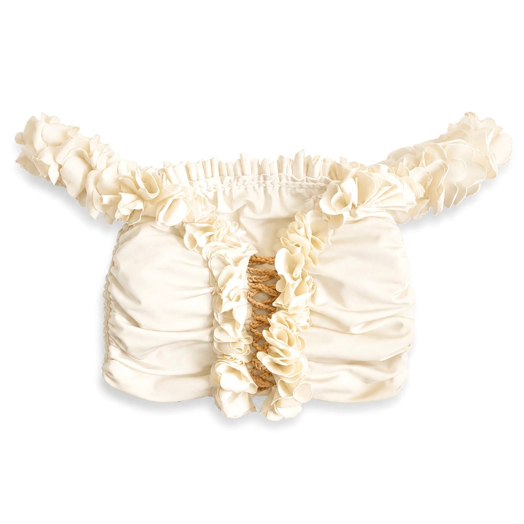 Magnolia cream floral off-the-shoulder crop top with flower lei trim and hand-crocheted lace-up center detail.