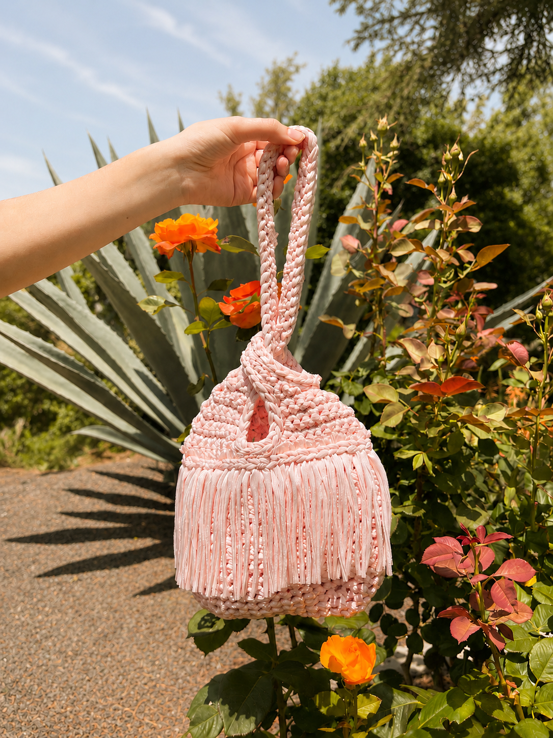 Crochet Petal pink fringe mini swing bag, handmade with stretch nylon/spandex. 