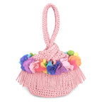 Handmade crochet mini swing bag in Petal pink with rainbow flower fringe and a loop-through wristlet handle.