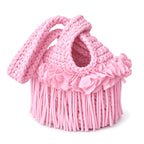 Handmade crochet mini swing bag in Petal pink with flower fringe and a loop-through wristlet handle.