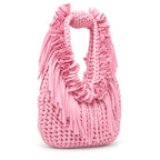 Petal pink hand-crocheted Flower Lei Mini bag with cascading floral ruffles and fringe, featuring a braided handle and sculptural mini silhouette.