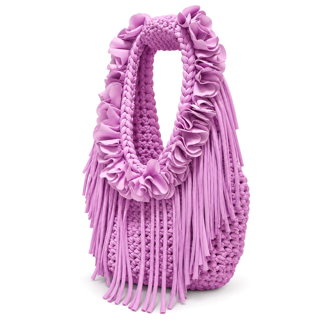 Orchid pink purple hand-crocheted Flower Lei Mini bag with cascading floral ruffles and fringe, featuring a braided handle and sculptural mini silhouette.
