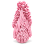 Petal pink hand-crocheted Flower Lei Mini bag with cascading floral ruffles and fringe, featuring a braided handle and sculptural mini silhouette.