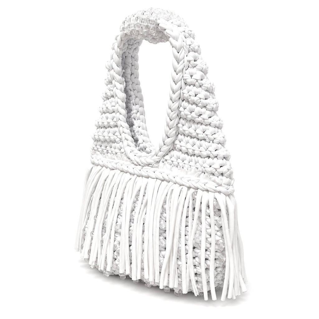 Gardenia white handmade crochet fringe mini bag with UV-reactive beads transforms into pink, purple, peach and pearly tones in sunlight.
