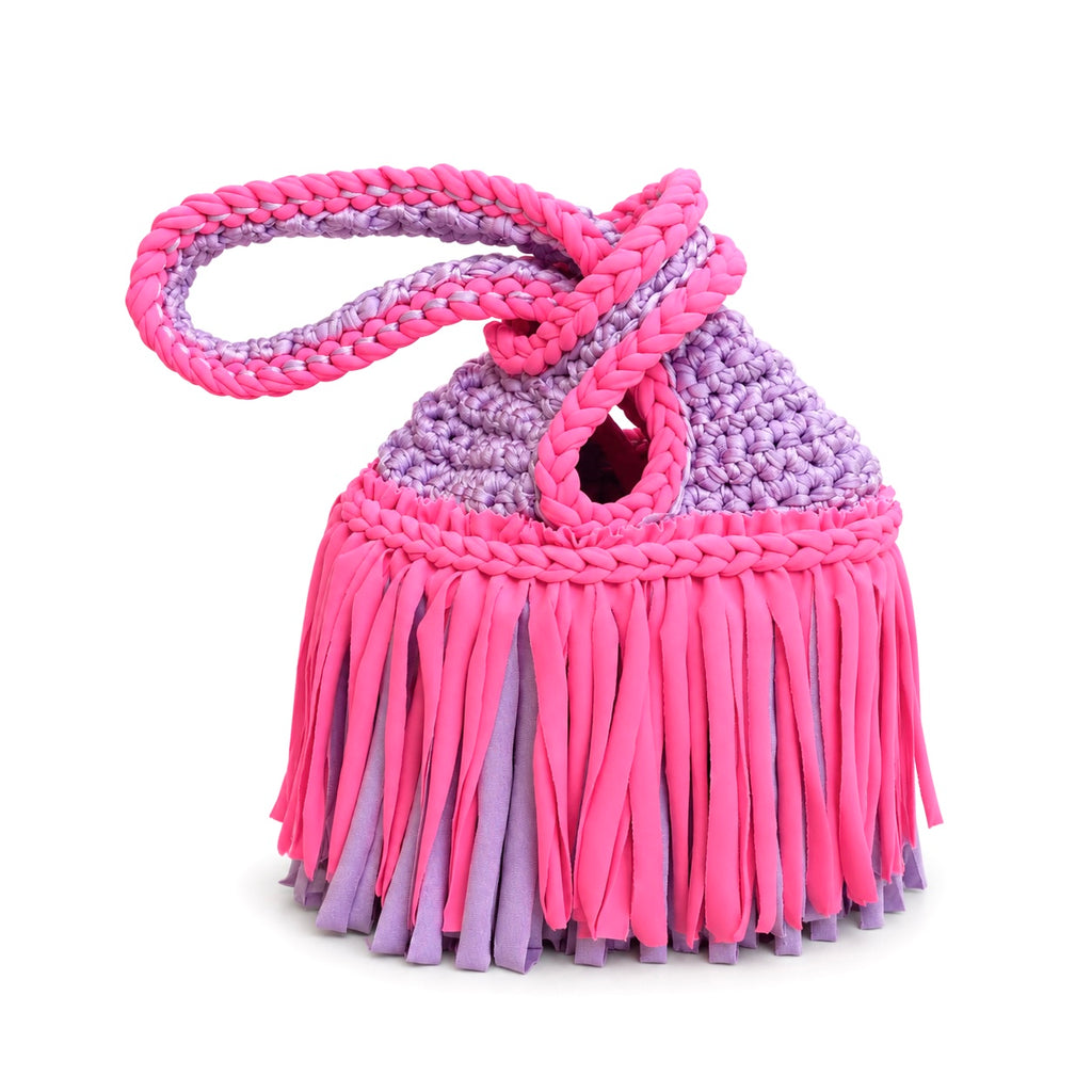 Handmade crochet mini swing bag in Hibiscus pink and Lilac purple with two-tone fringe and a loop-through wristlet handle.