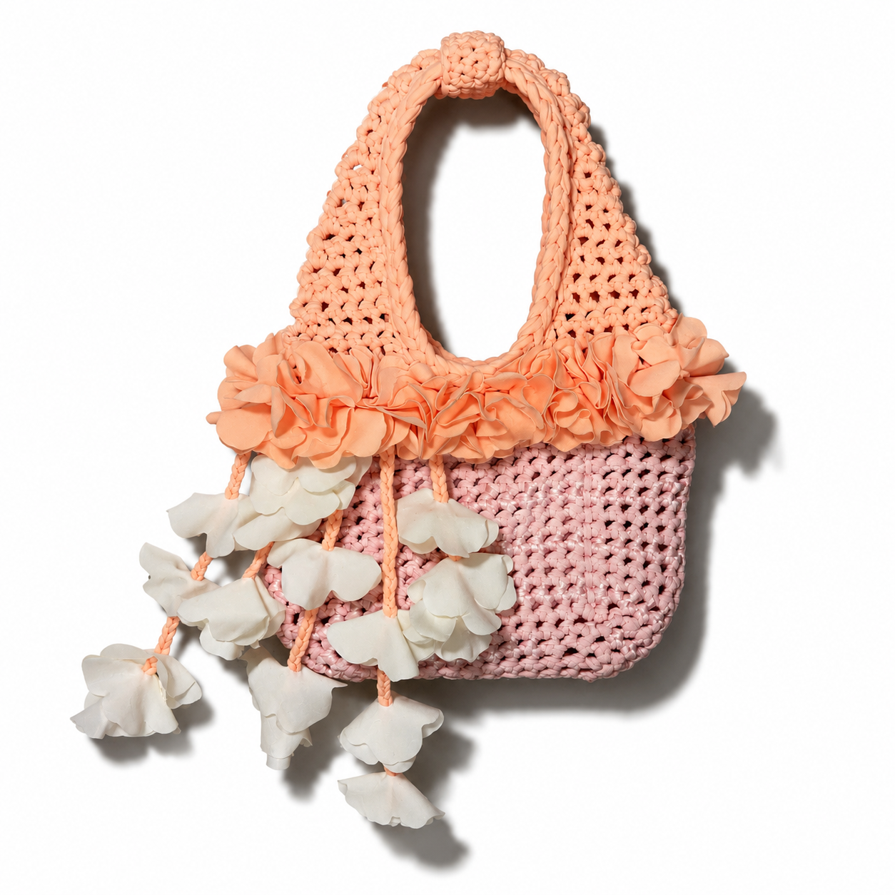 Handmade petal pink and poppy orange crochet floral mini bag with magnolia cream cascading petal bells. 