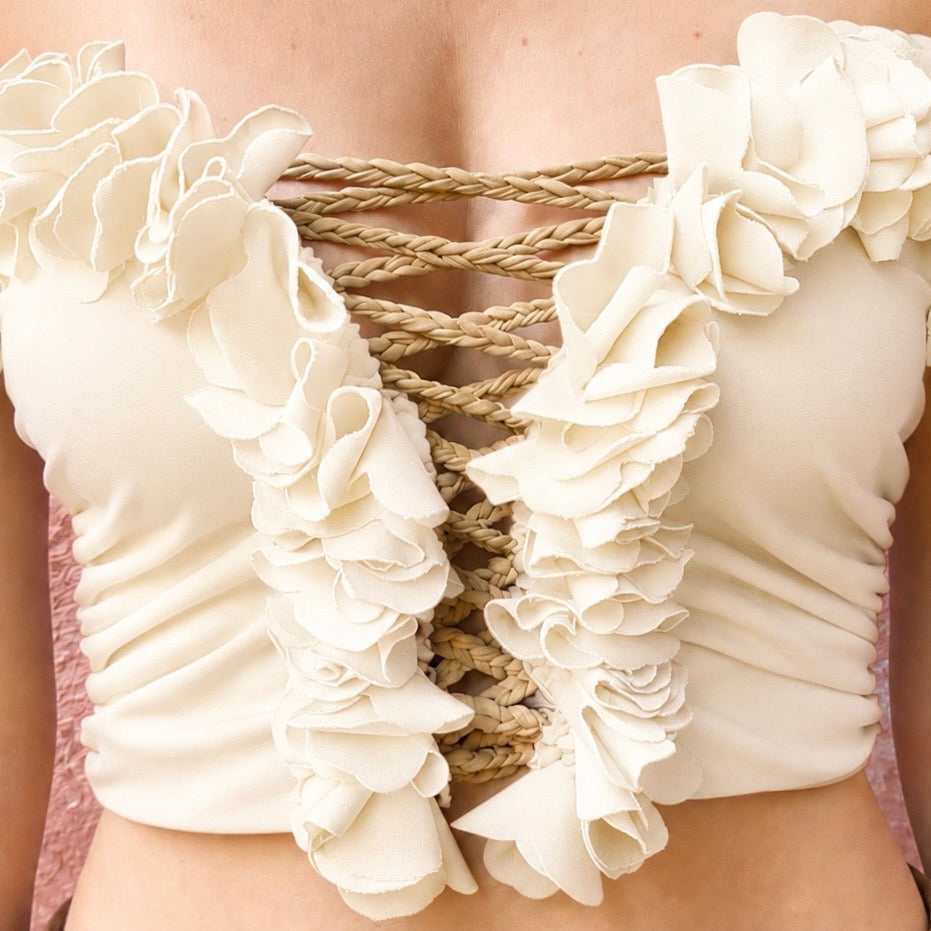 Magnolia cream floral tube top with flower lei trim and hand-crocheted, open lace-up center detail.