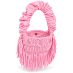 Petal pink handmade crochet Cha Cha Mini bag featuring a crescent-shaped body, braided loop detailing, ruched scrunchie handle and flowing fringe. 