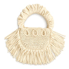 Magnolia cream handmade crochet Cha Cha Mini bag featuring a crescent-shaped body, braided loop detailing, ruched scrunchie handle and flowing fringe. 