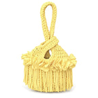Handmade crochet mini swing bag in Daffodil light yellow with flower fringe and a loop-through wristlet handle.