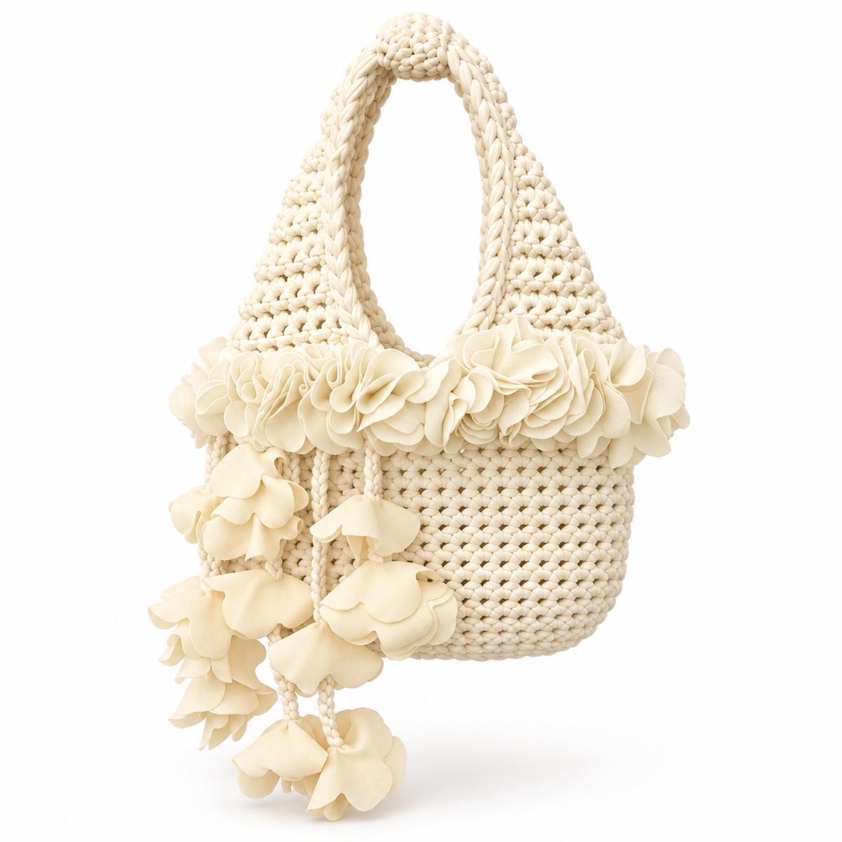 Handmade crochet petal bell mini bag in magnolia cream with braided handle and cascading petal trim. 
