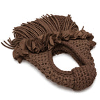 Handmade Coconut Shell dark brown crochet mini bag with sculptural floral trim, flowing fringe and a braided handle.