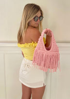 Daffodil yellow off-the-shoulder flower lei tube top with floral trim and hand-crocheted lace-up center detail.