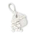 Handmade crochet petal bell mini swing bag in gardenia white with a loop through wristlet handle and cascading petal trim. 