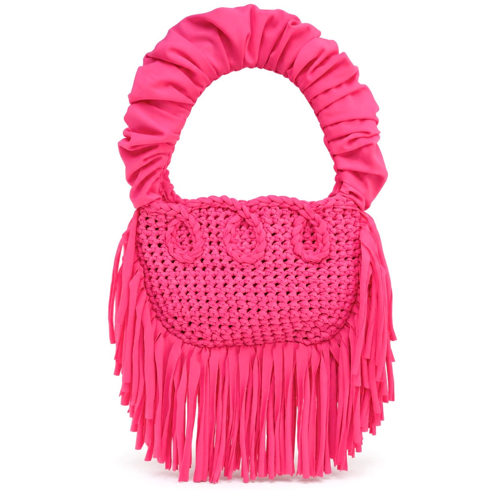 Hibiscus pink handmade crochet Cha Cha Mini bag featuring a crescent-shaped body, braided loop detailing, ruched scrunchie handle and flowing fringe. 