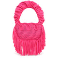 Hibiscus pink handmade crochet Cha Cha Mini bag featuring a crescent-shaped body, braided loop detailing, ruched scrunchie handle and flowing fringe. 