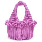 Handmade Orchid pink purple crochet mini bag with sculptural floral trim, flowing fringe and a braided handle.