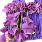 Handmade lilac purple crochet whimsy mini bag with cascading floral fringe and braided orchid petal bells.