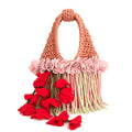 Handmade pink and tan strawberry suede crochet whimsy mini bag with floral fringe and braided tulip red cascading petal bells.