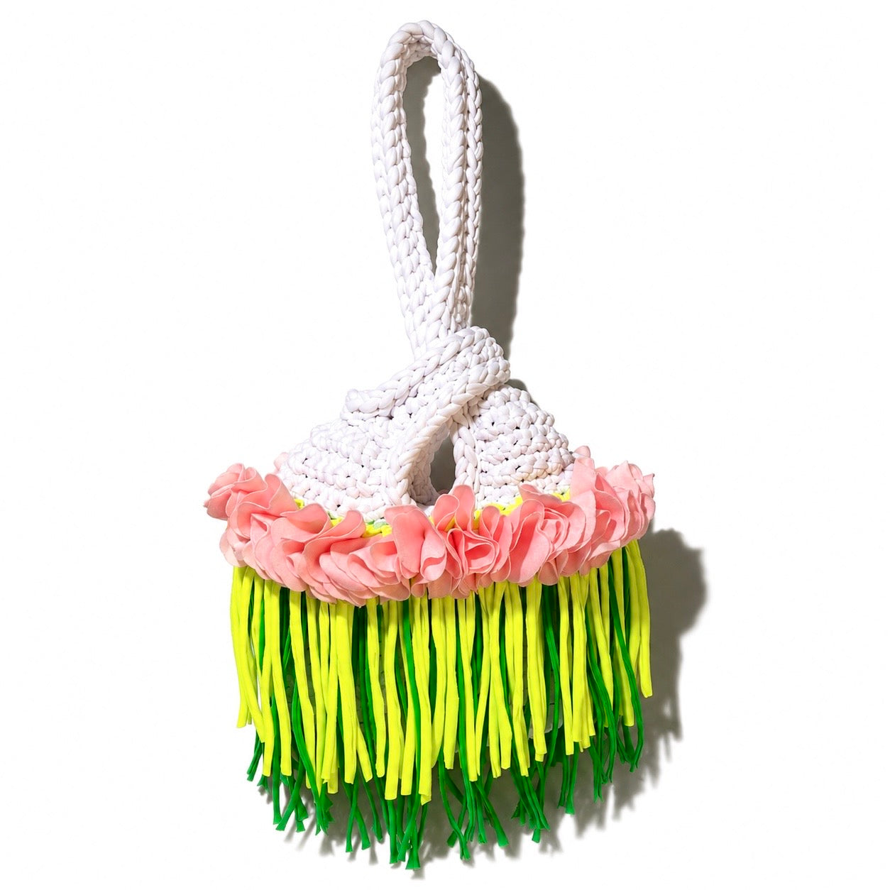 Handmade crochet mini swing bag in Gardenia white with pink flowers and tennis green fringe, featuring a loop-through wristlet by Daisy C. 