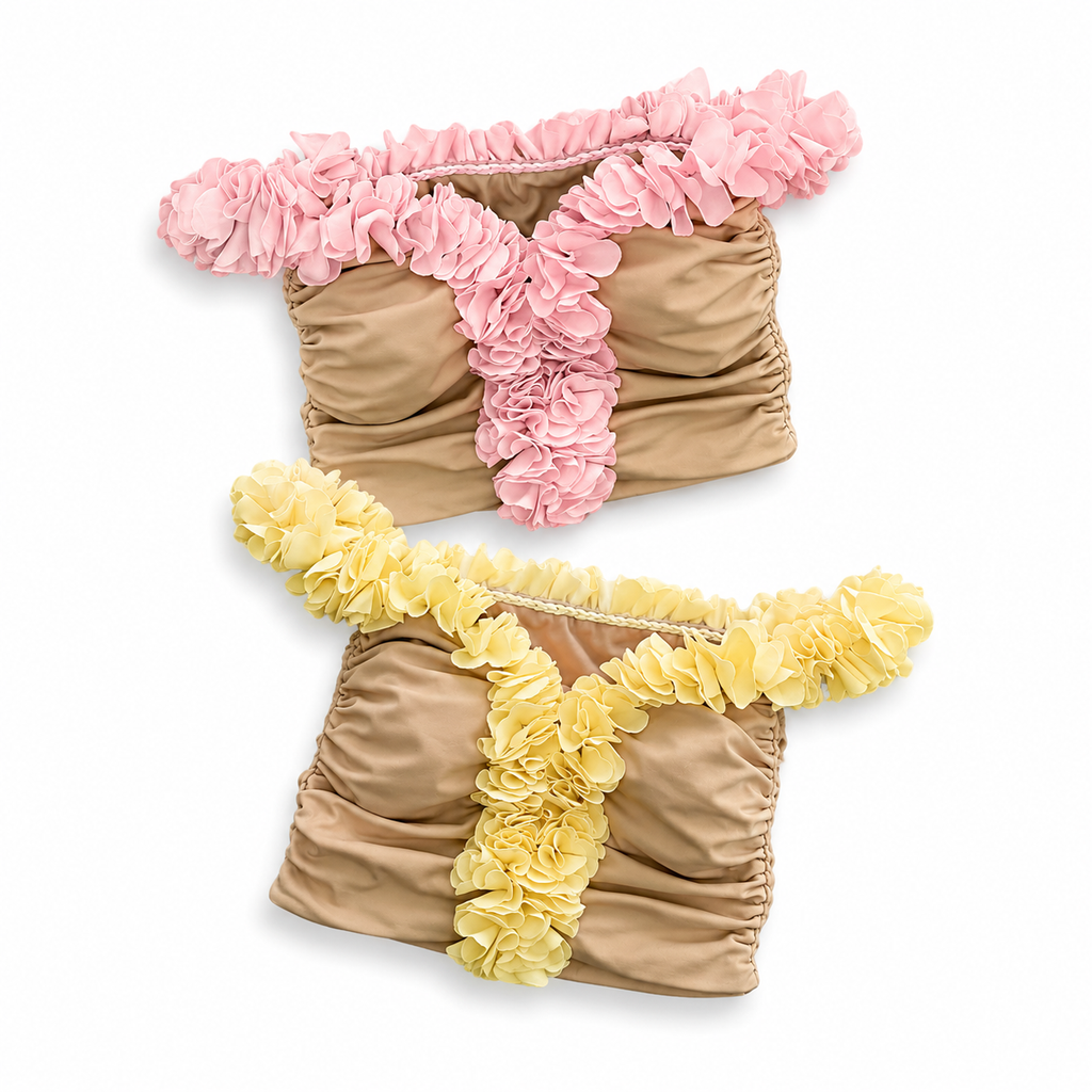 Petal pink and Daffodil yellow floral off-the-shoulder crop tops with flower lei trim and hand-crocheted lace-up center detail.