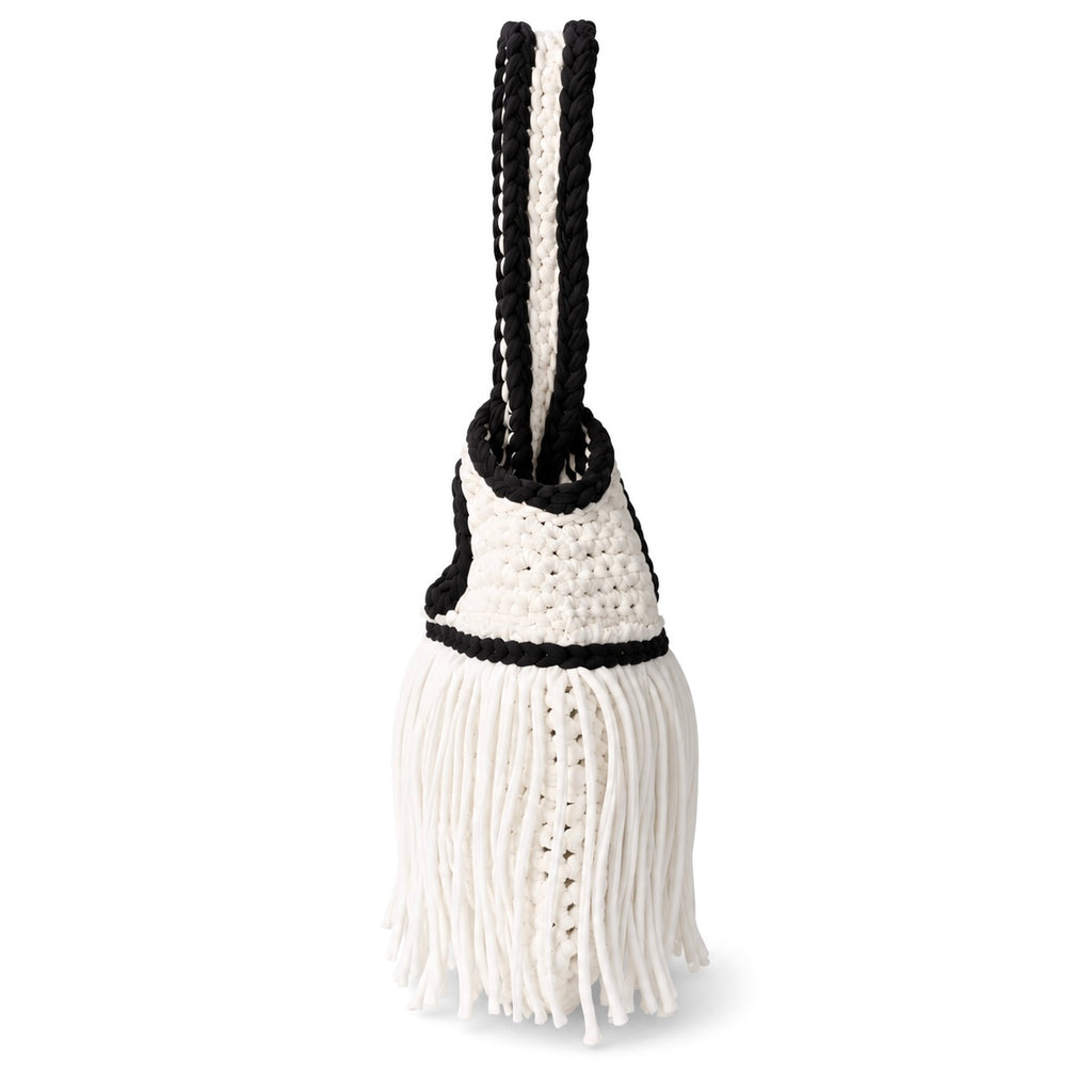 Handmade crochet mini swing bag in Gardenia white with flowing fringe, Onyx black trim and a loop-through wristlet handle.