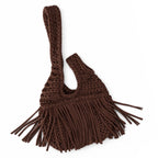 Handmade crochet mini swing bag in Coconut brown with flowing fringe and a loop-through wristlet handle.