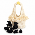 Handmade magnolia cream and onyx black crochet petal bell floral mini bag