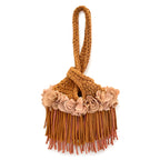 Handmade Hazelnut brown crochet mini swing bag with tan flowers and flowing fringe with a loop-through wristlet handle.