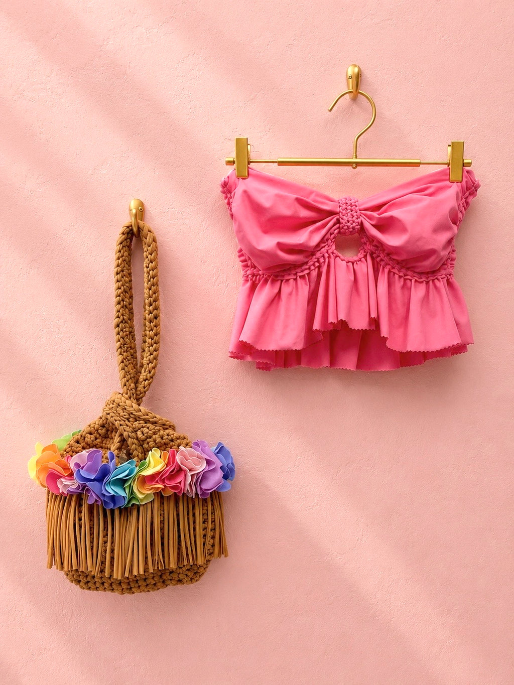 Handmade hazelnut brown crochet rainbow flower fringe mini swing bag with hibiscus hot pink ruffle bow top. 