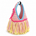 Handmade crochet fringe mini bag in Petal pink with Hydrangea blue, Hibiscus pink and Daffodil yellow details and flowing fringe.