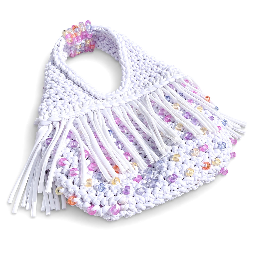 Gardenia white handmade crochet fringe mini bag with UV-reactive beads transforms into pink, purple, peach and pearly tones in sunlight.