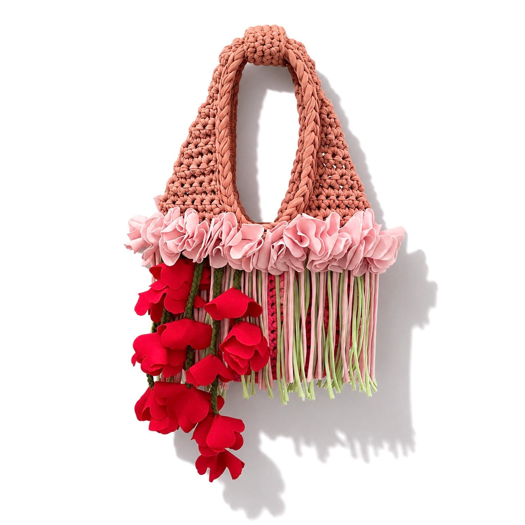 Handmade pink and tan strawberry suede crochet whimsy mini bag with floral fringe and braided tulip red cascading petal bells.
