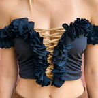 Onyx black off-the-shoulder flower lei tube top with floral trim and hand-crocheted lace-up center detail.