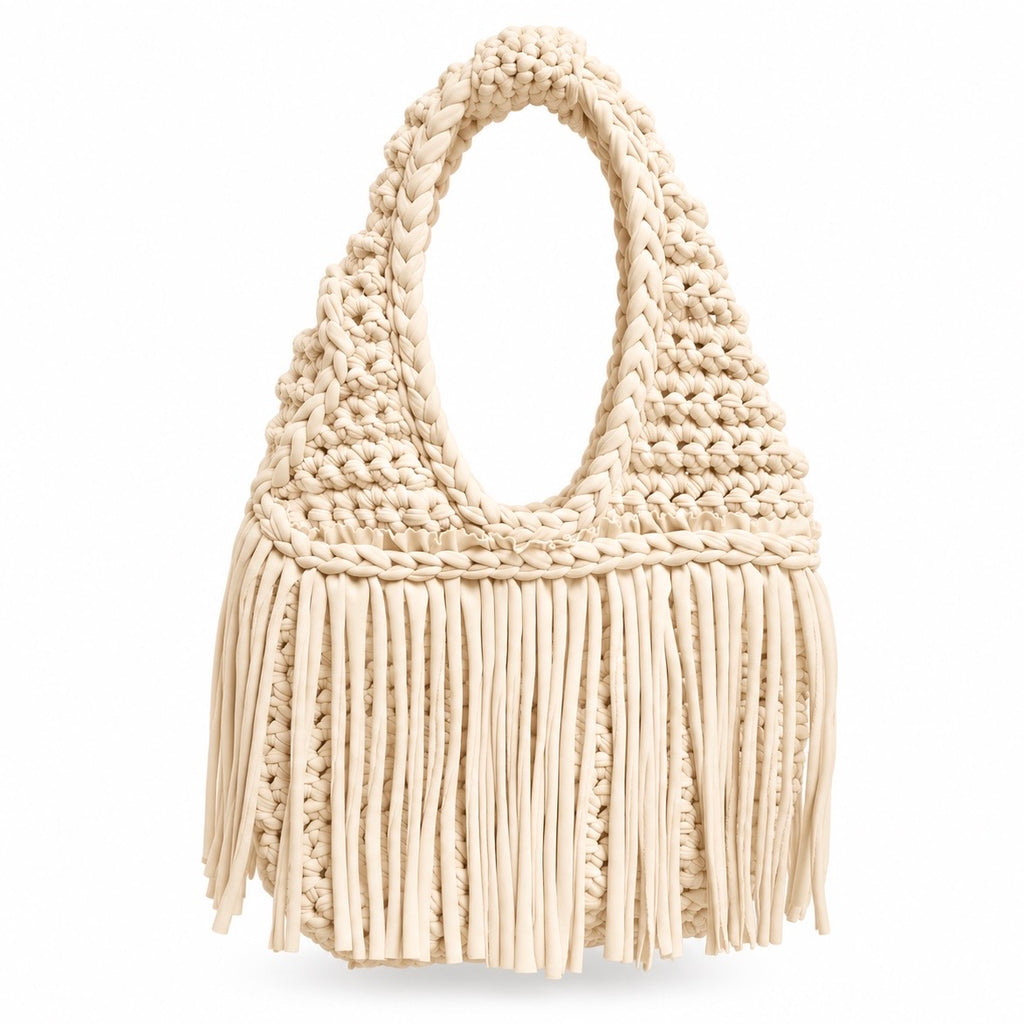 Handmade Magnolia cream crochet fringe mini bag with flowing fringe and a braided handle.