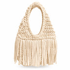 Handmade Magnolia cream crochet fringe mini bag with flowing fringe and a braided handle.